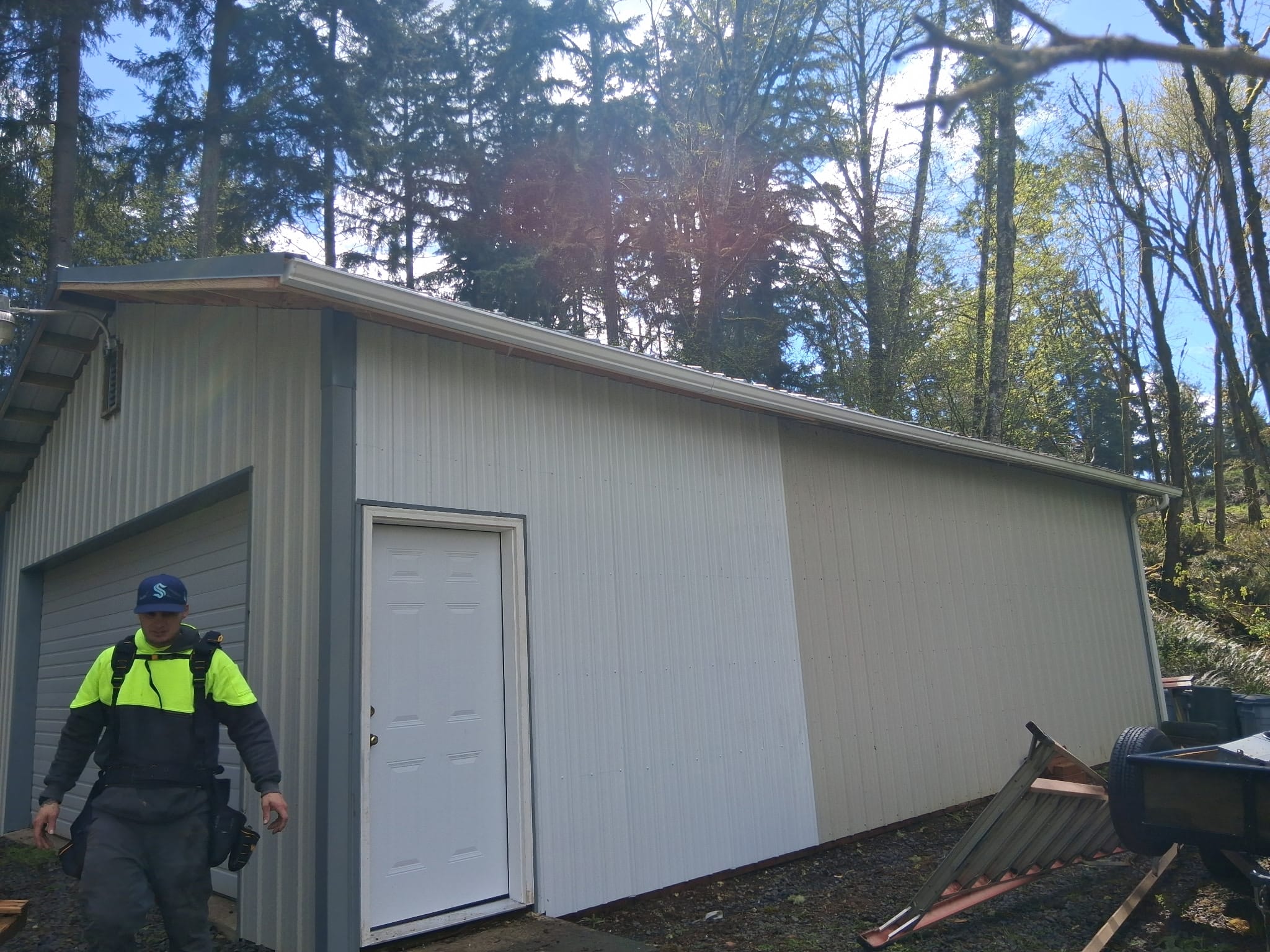 Metal roof and siding rebuilt after fallen-tree storm damage