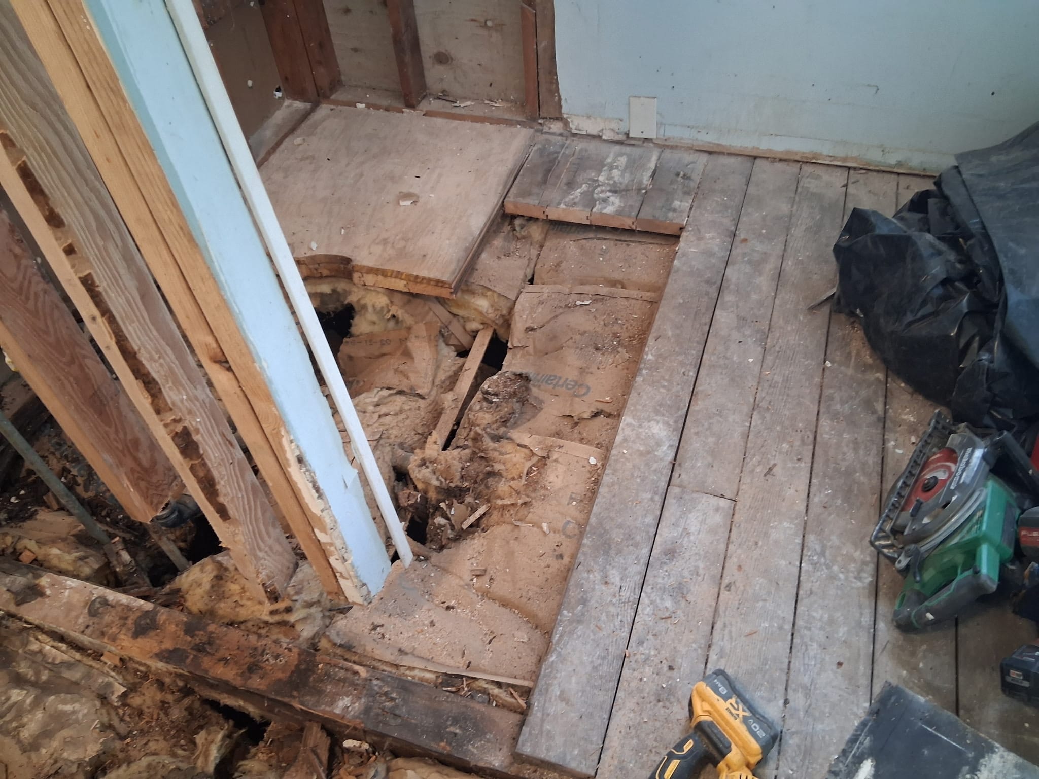 Bathroom subfloor demolition during dry rot repair