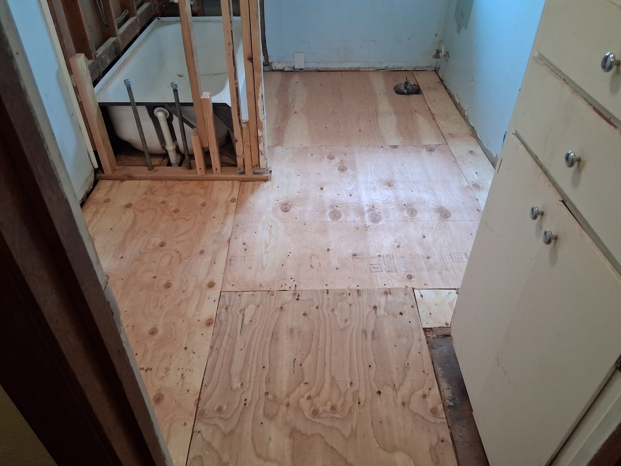 New bathroom subfloor after dry rot repair